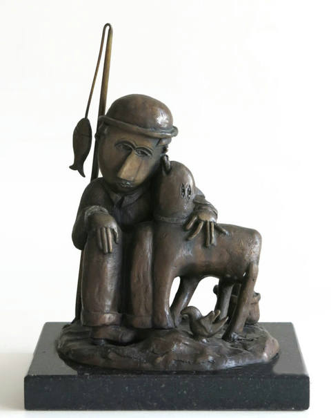 Pescador com cachorro