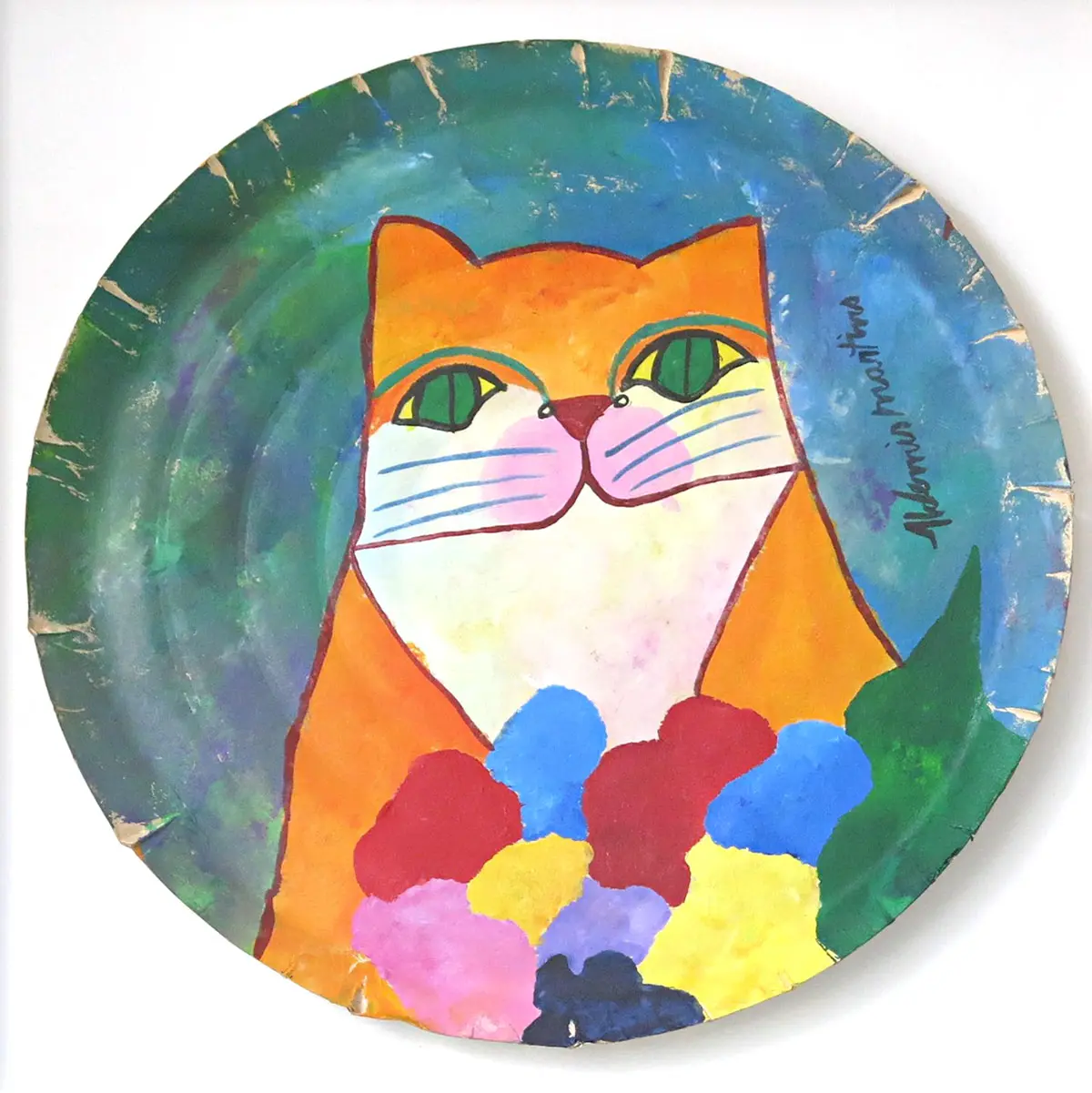 Gato laranja com flores