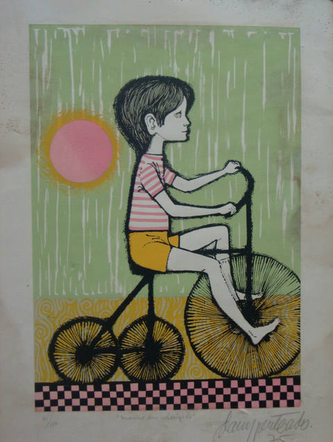 Menino em velocípede
